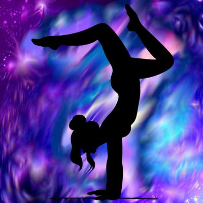 a woman doing a handstand