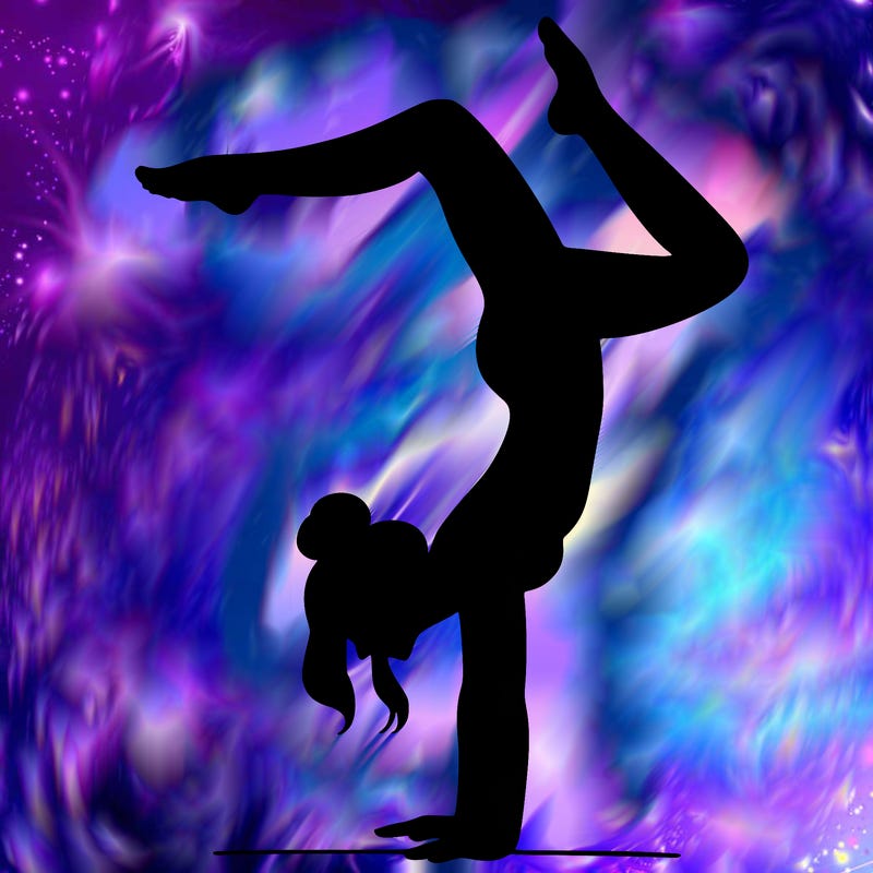 a woman doing a handstand