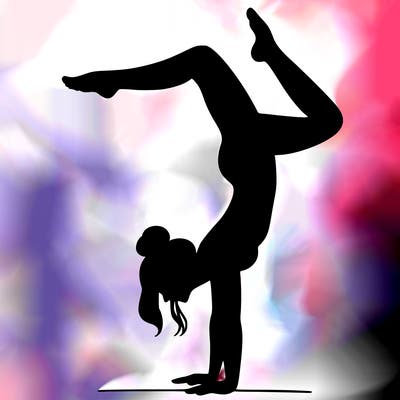 a woman doing a handstand