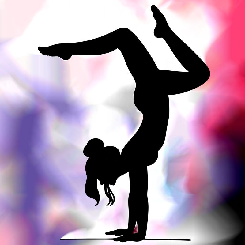 a woman doing a handstand