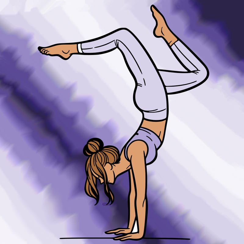a woman doing a handstand