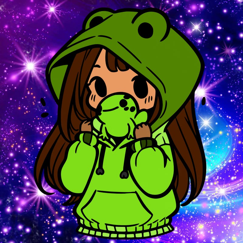 a girl holding a froggy hoodie
