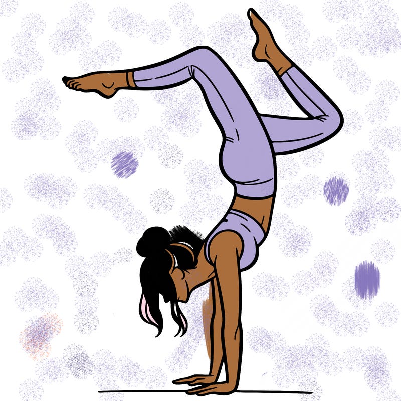 a woman doing a handstand
