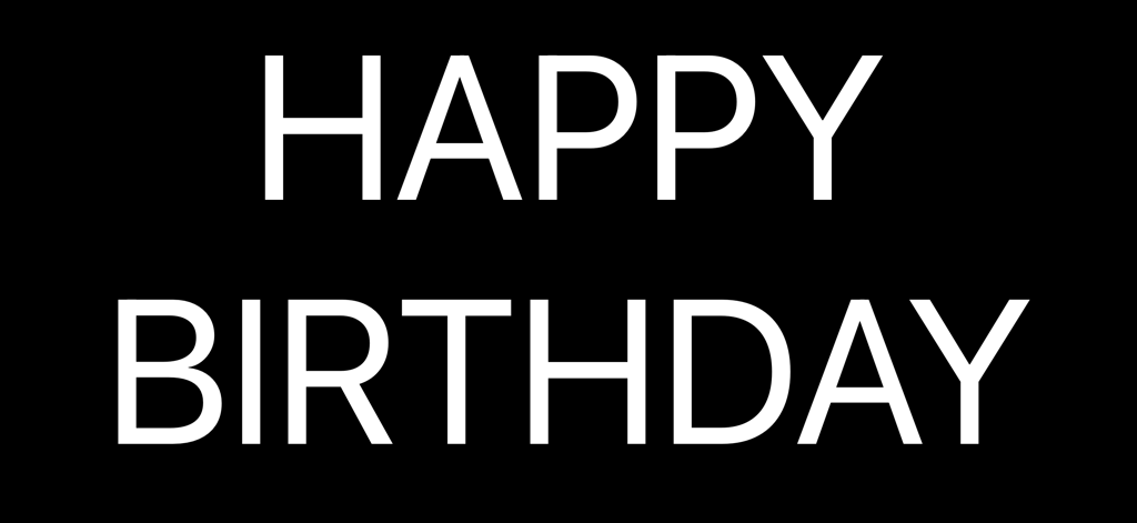 Minimalist white Happy Birthday text on a black background from the Fullscreen Clock app