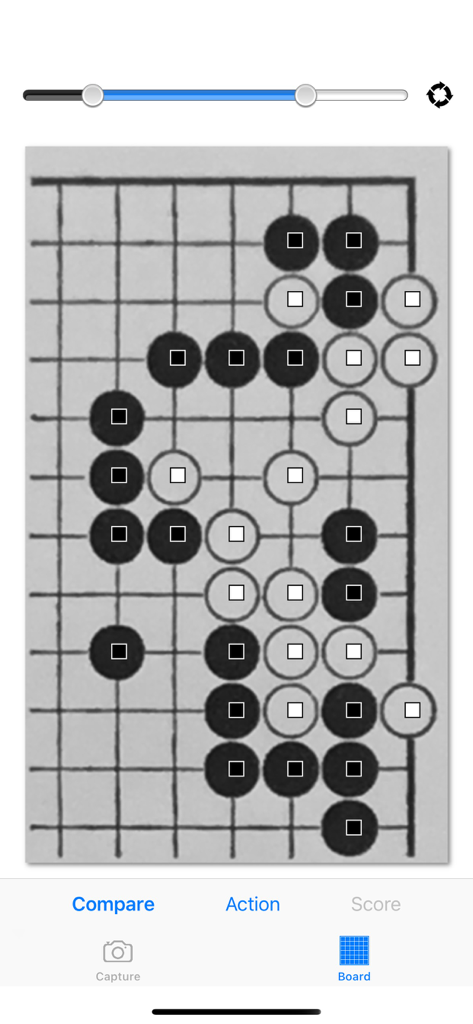 Baduk Cap - A screenshot of the Baduk Cap app showing image recognition of black and white stones on a Go board