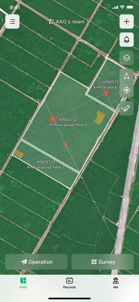 Satellite map view showing farm field boundaries and drone operation controls in the XAG One app.
