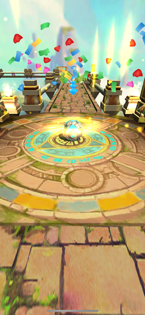 Temple Rolling Balls - A glowing ball on an ancient stone platform with falling confetti