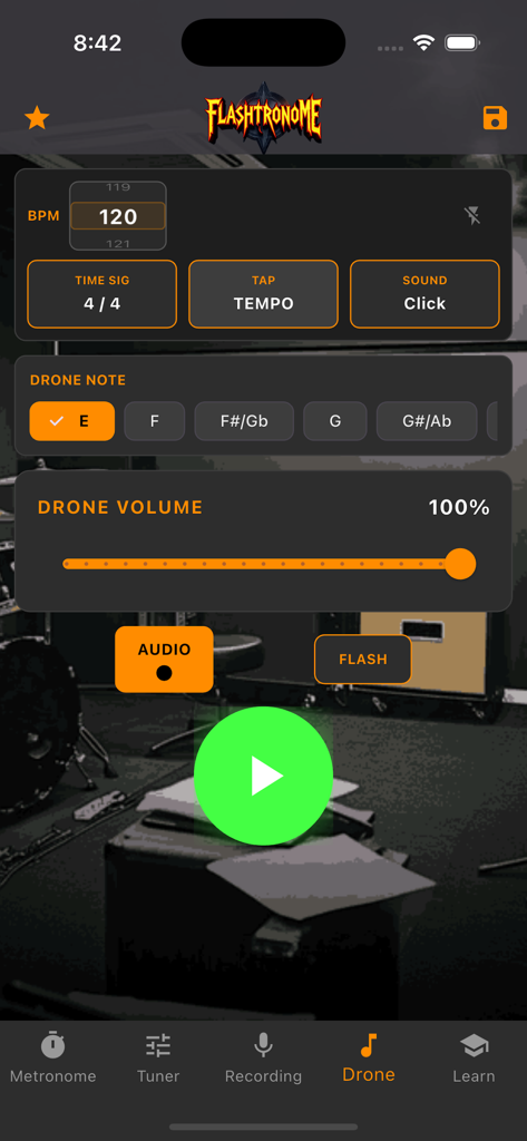 Flashtronome - Flashtronome app interface showing the drone note feature with pitch selection and volume control over a background of music equipment