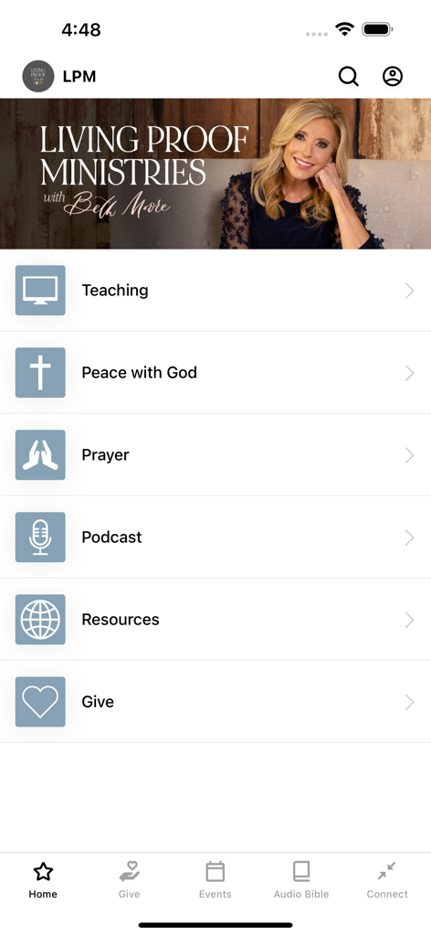 Living Proof with Beth Moore - The home screen of the Living Proof with Beth Moore mobile app showing various ministry categories like teaching prayer and podcasts