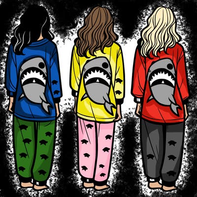 shark themed pajamas on a women