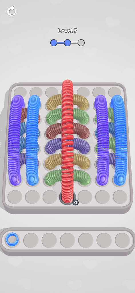 Slinky Jam gameplay showing colorful slinky toys in a sorting puzzle grid