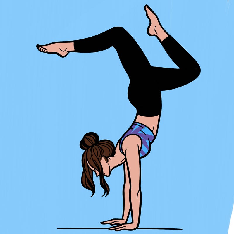 a woman doing a handstand