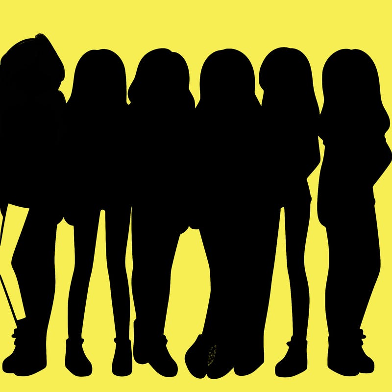 a group of girls wearing crop tops and shorts