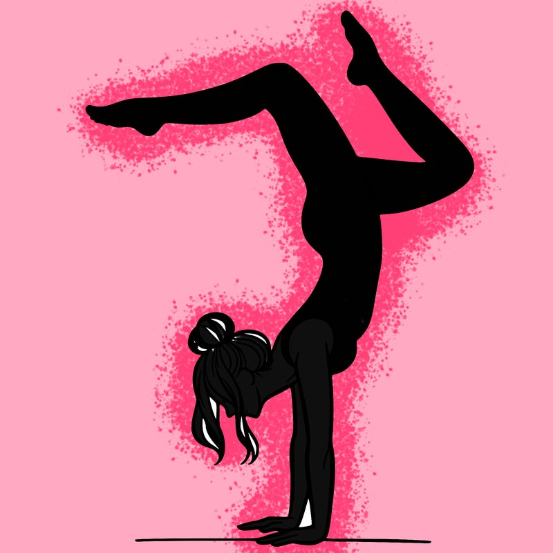 a woman doing a handstand