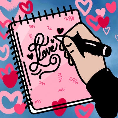 a hand writing “love” in calligraphy on a notebook