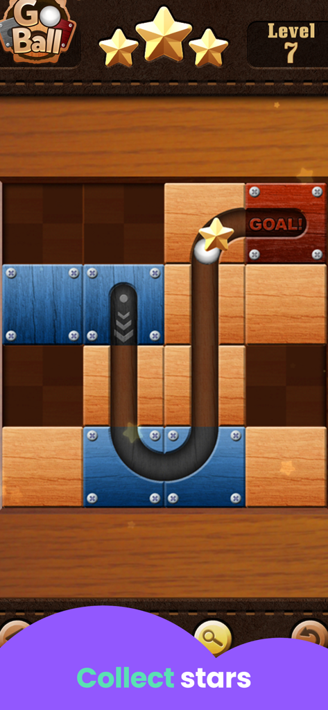 A child playing the Go Ball logic puzzle game where a white ball travels through a wooden path to reach a goal while collecting stars