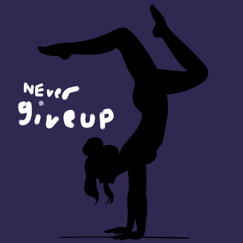 a woman doing a handstand