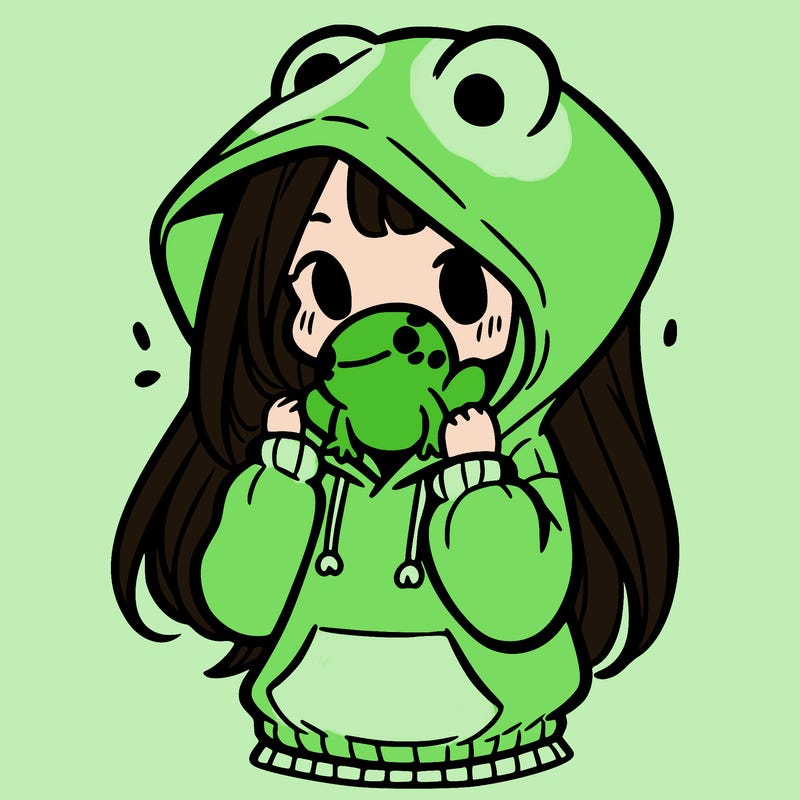 a girl holding a froggy hoodie