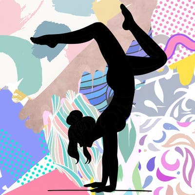 a woman doing a handstand