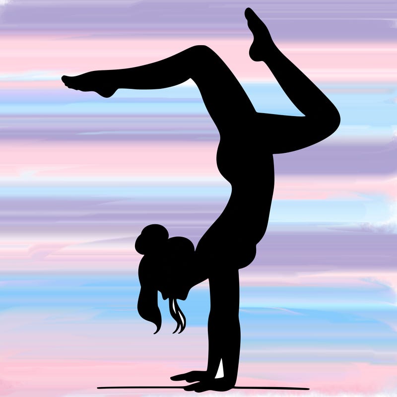 a woman doing a handstand