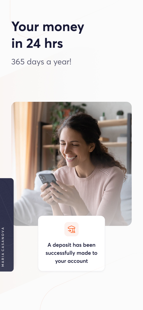 Business owner smiling at a successful 24 hour deposit notification on her phone