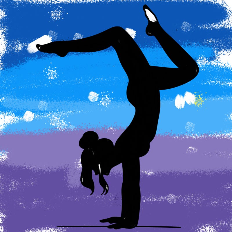 a woman doing a handstand