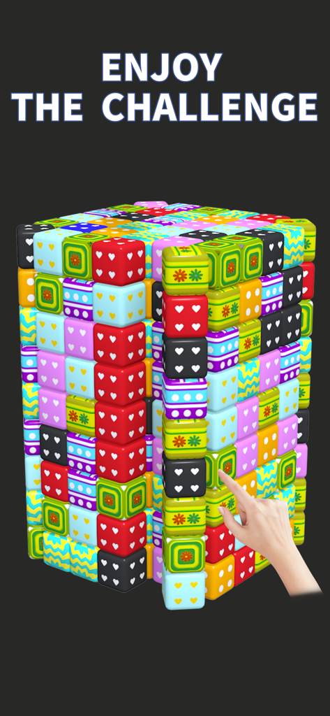 A hand interacting with a large 3D cube made of colorful patterned tiles in a mobile puzzle game.