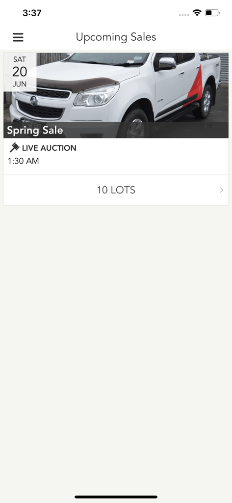 Mainland Auctions mobile app interface showing the upcoming sales screen with a white truck listed for a live auction.