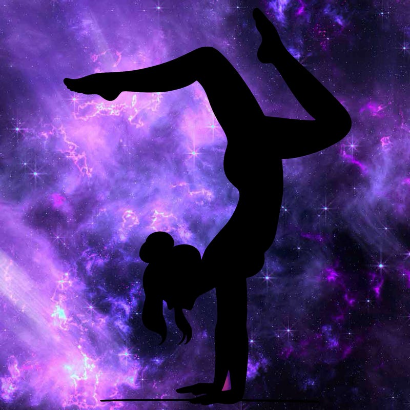 a woman doing a handstand