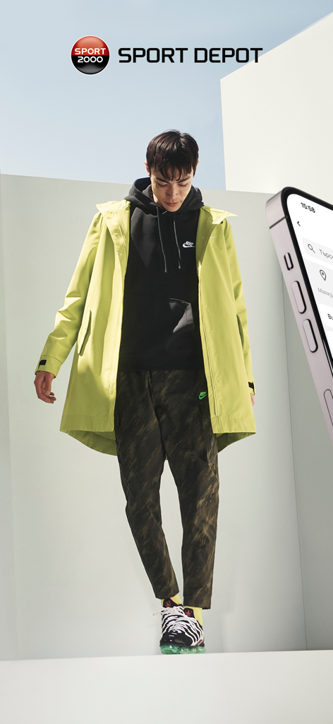 Un modèle masculin portant des vêtements de sport Nike et une veste vert citron représentant la mode Sport Depot