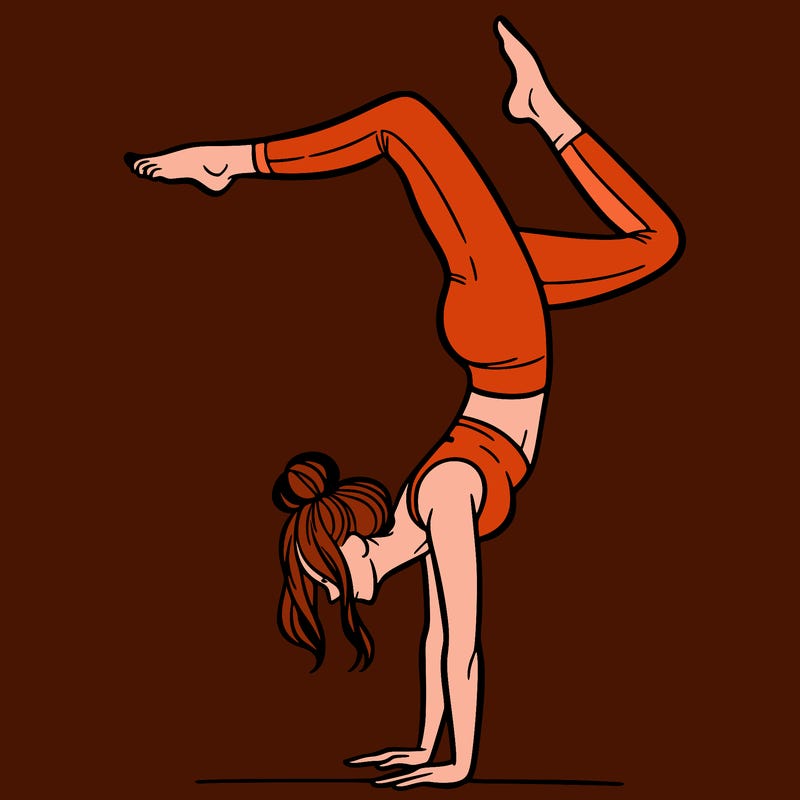 a woman doing a handstand