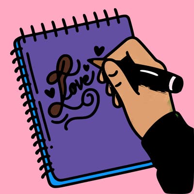 a hand writing “love” in calligraphy on a notebook