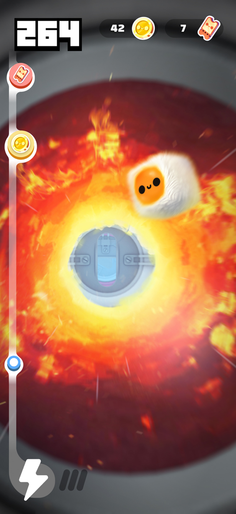 A white fluffy character flying through a fiery obstacle tunnel in Fluffy Fall game