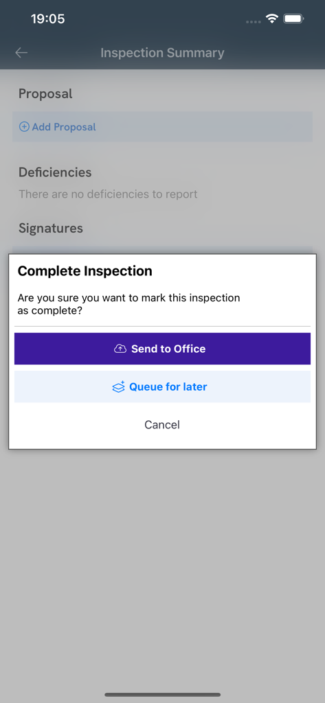 The Inspect Point app interface showing a popup to mark a fire safety inspection as complete with options to send to office or queue for later
