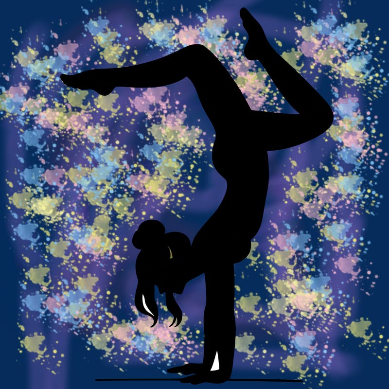 a woman doing a handstand