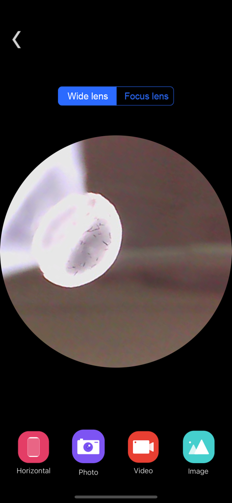 Xiao-E - Xiao-E mobile app interface showing a real-time digital otoscope camera feed with photo and video controls.