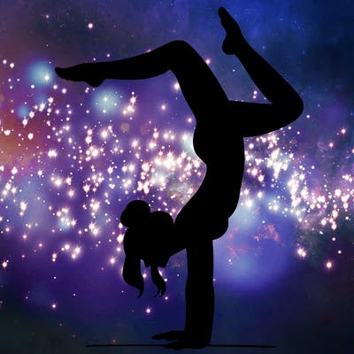 a woman doing a handstand