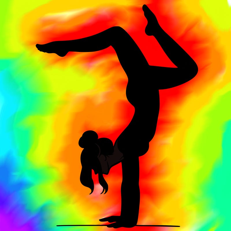 a woman doing a handstand