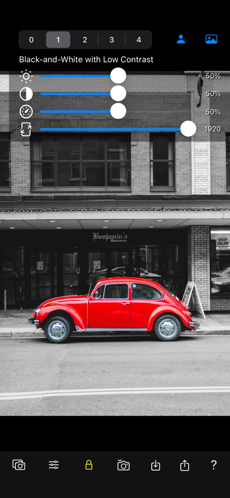 Color Focus Lens - A red vintage car highlighted in color against a black and white street background using the Color Focus Lens app.