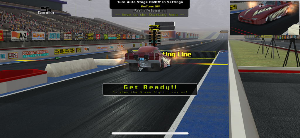 A red dragster car at the starting line of a drag strip in the EV3 simulation game