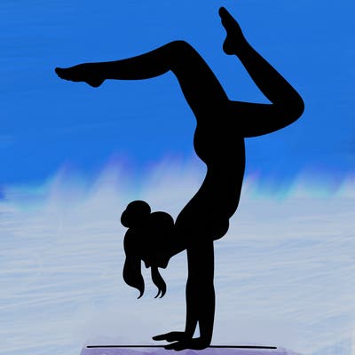 a woman doing a handstand