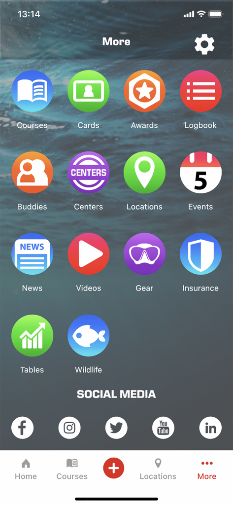 Main menu screen of the MySSI app showing diving icons for courses logbook and gear