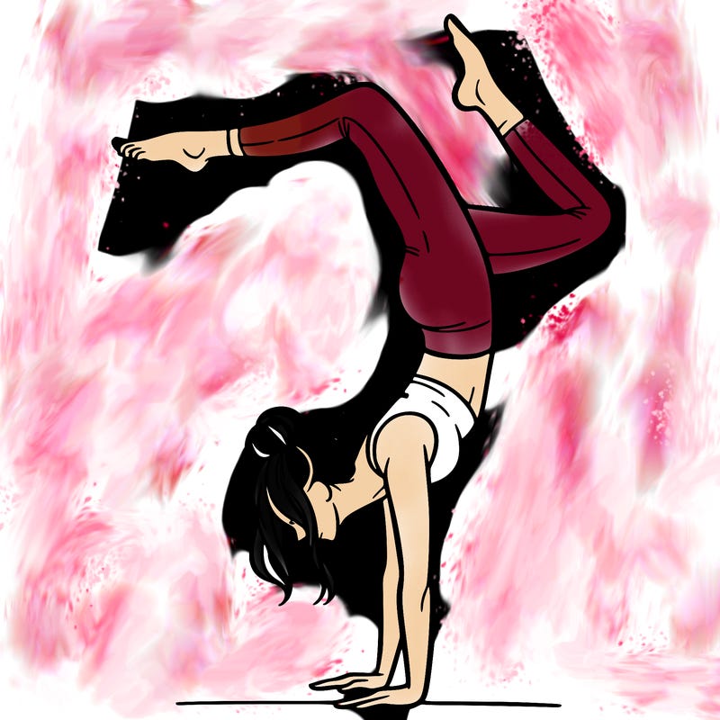 a woman doing a handstand