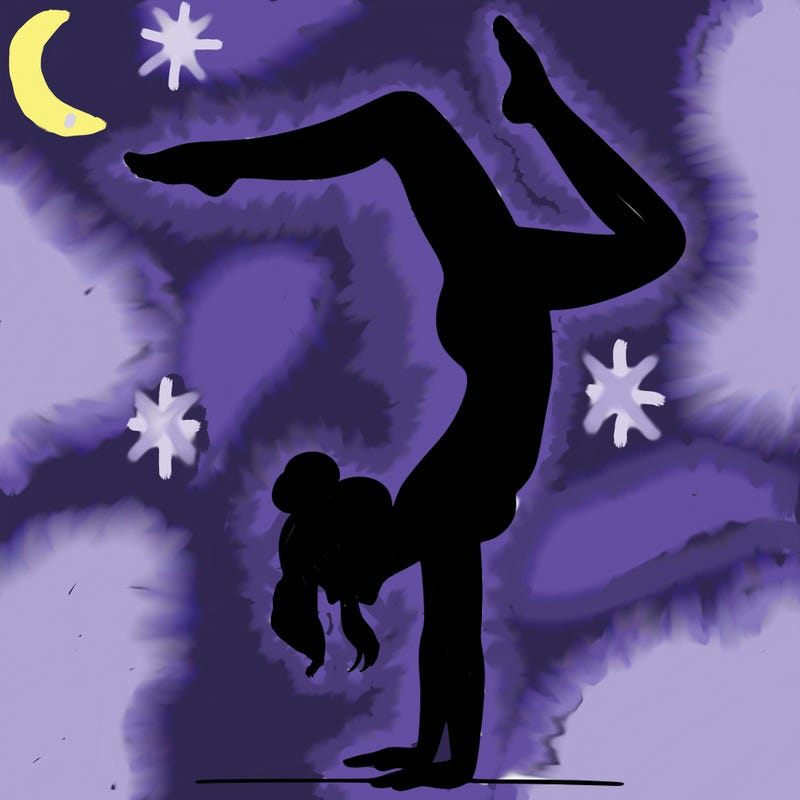 a woman doing a handstand