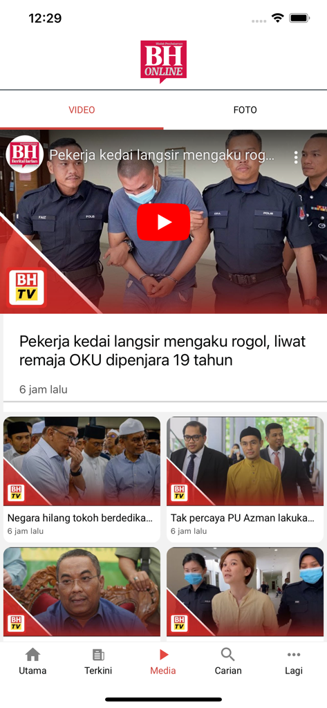 Screenshot of the Berita Harian Mobile app media tab featuring news videos and articles in Bahasa Melayu
