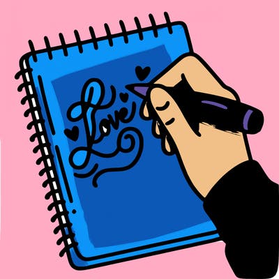 a hand writing “love” in calligraphy on a notebook