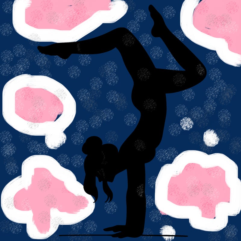 a woman doing a handstand