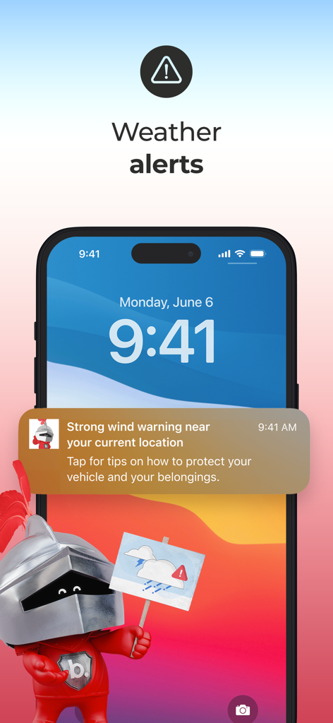 Smartphone screen displaying a weather alert notification for strong wind warning