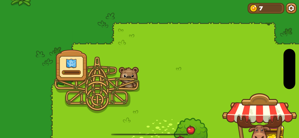 Olly the bear standing next to a wooden airplane frame in a grassy field