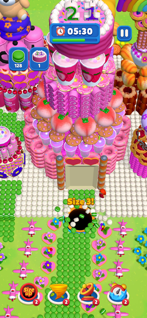 Ever Eater 3D - Screenshot del gioco mobile Ever Eater 3D di un buco nero che inghiotte oggetti in un vibrante mondo di caramelle rosa